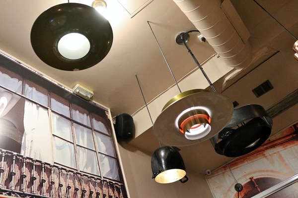 funky lighting fixtures hanging from a restaurant ceiling