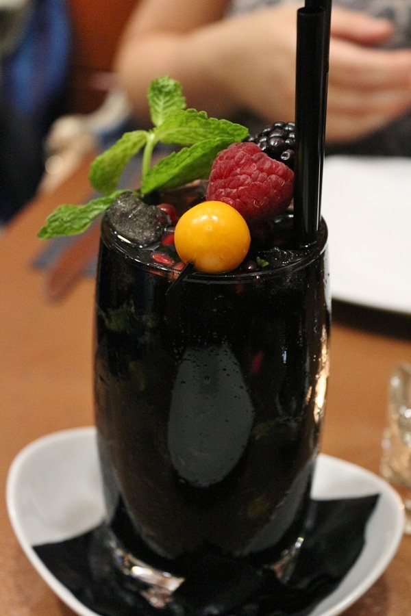 a blackberry mojito in a tall glass