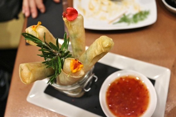 overhead view of a jar filled with spring rolls