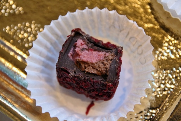 a half-eaten piece of chocolate in a small paper cup