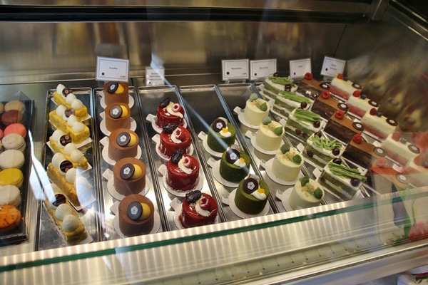 A display case filled with fancy desserts