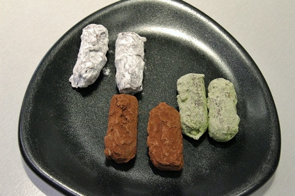 cylindrical shaped chocolate truffles in different colors