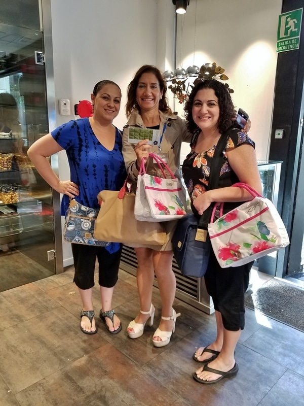 3 women posing inside a shop