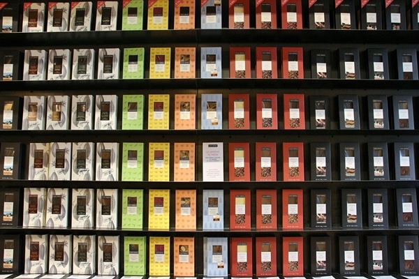 a wall covered with chocolate bars for sale