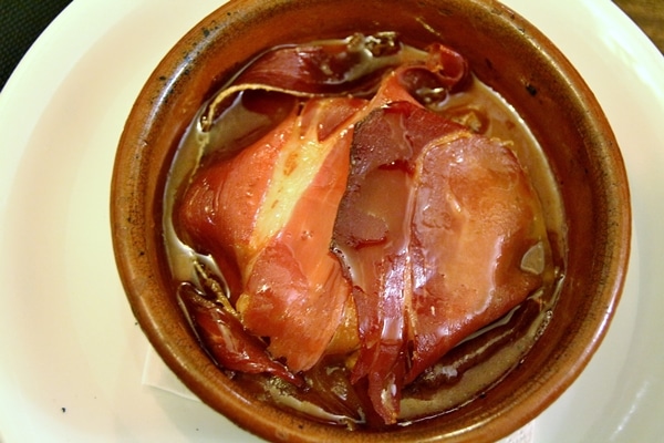 a dish of cooked ham wrapped cheese