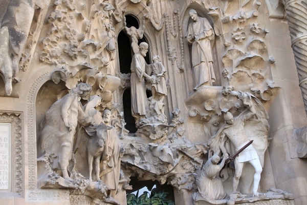 religious carvings on the stone exterior of Sagrada Familia church