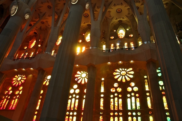 yellow and red stained glass windows inside a church