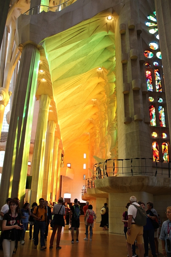 bright colorful light streaming through stained glass windows in a church