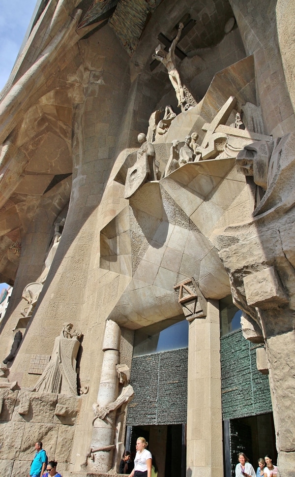 entrance to Sagrada Familia surrounding by cubist statues