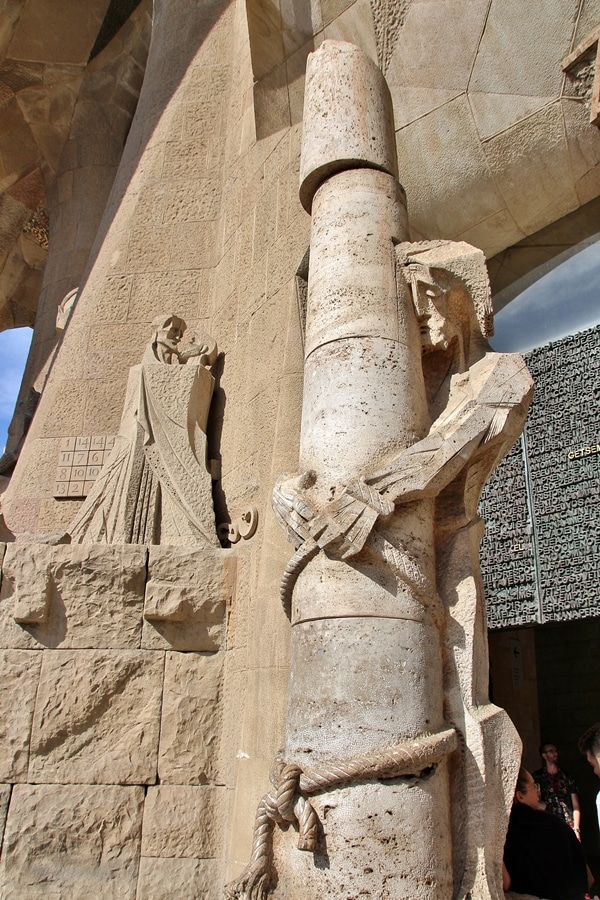 a cubist statue of Jesus outside Sagrada Familia