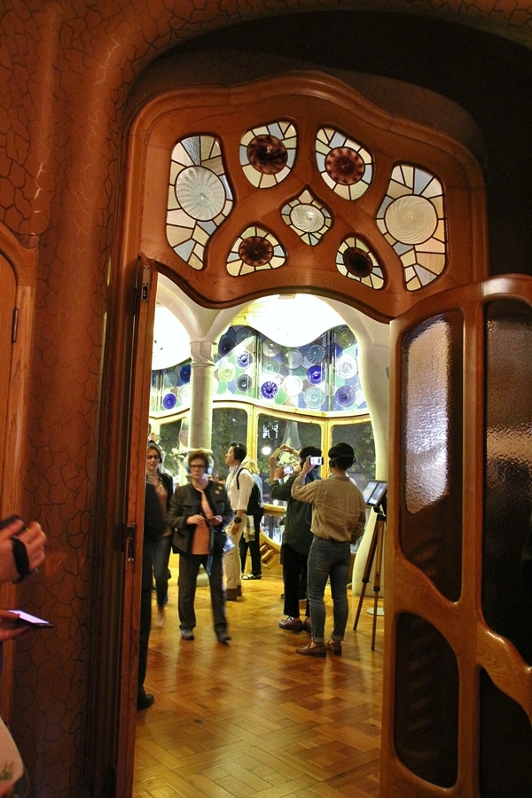 entrance to a room with a curvy door