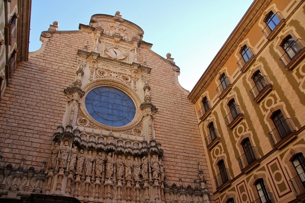 A large brick building with intricate sculptures on its facade