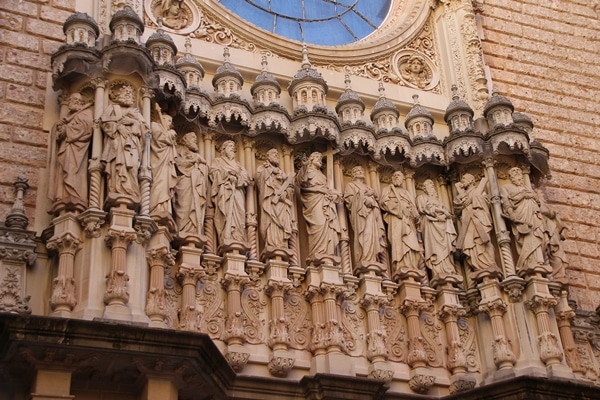 closeup of religious sculptures in front of a church