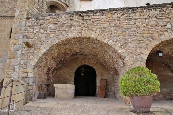 A large stone arch on the side of a building