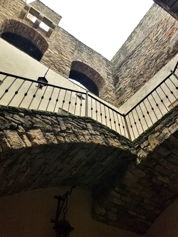 A view of a stone staircase on the side of an old building