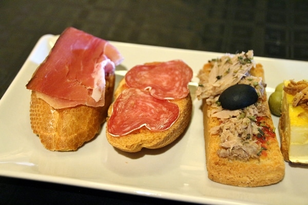 closeup of a variety of tapas on a white plate