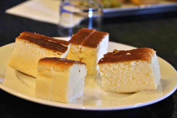 several pieces of cake on a white plate