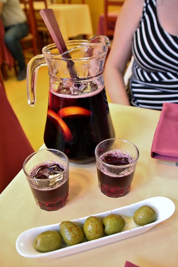 a pitcher and 2 glasses of sangria