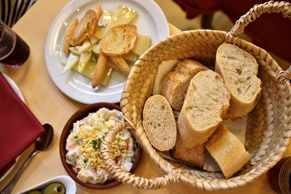 a bread basket and a cheese plate
