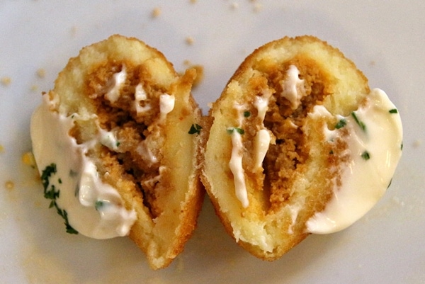 cross section of a fried potato ball stuffed with meat
