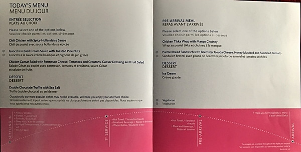 A close up of an airplane food menu