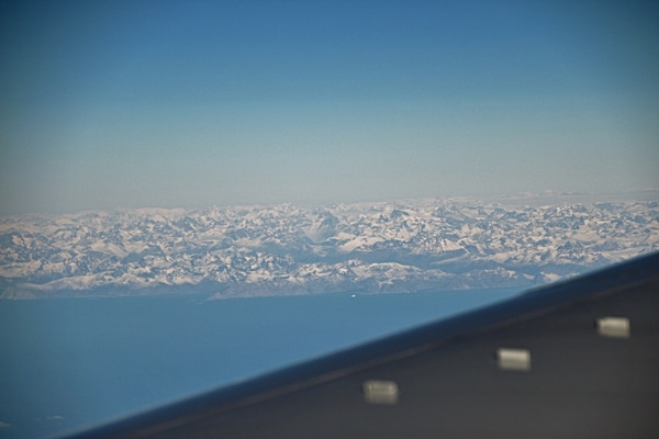 distant view of Greenland from an airplane window