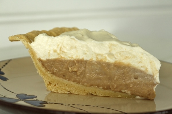 side view of a slice of Earl Grey cream pie on a plate