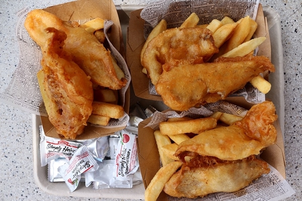 fish and chips baskets on a tray