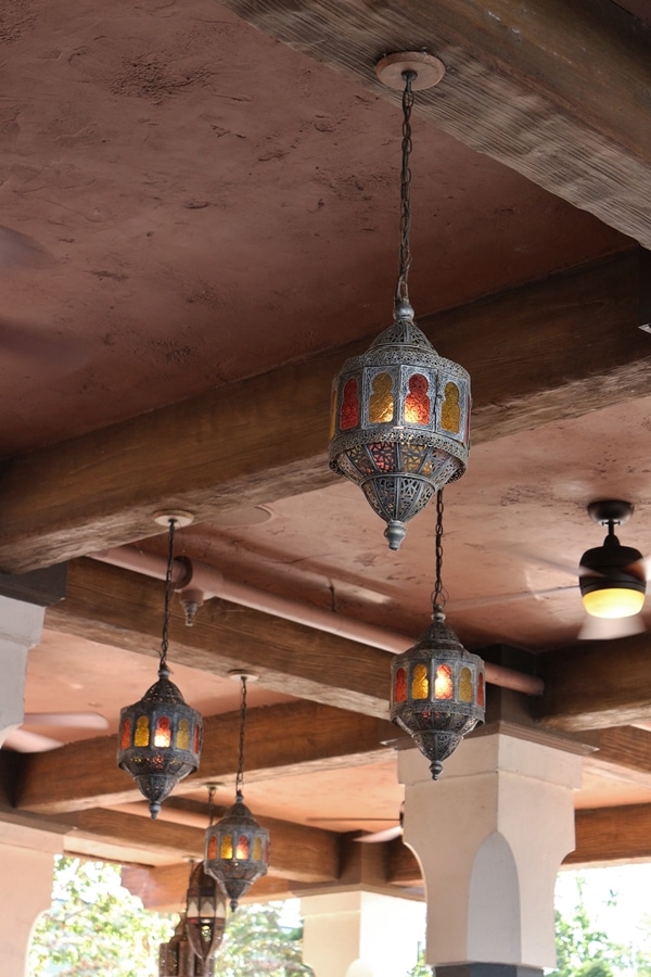 rustic lantern-style lighting fixtures hanging from the ceiling