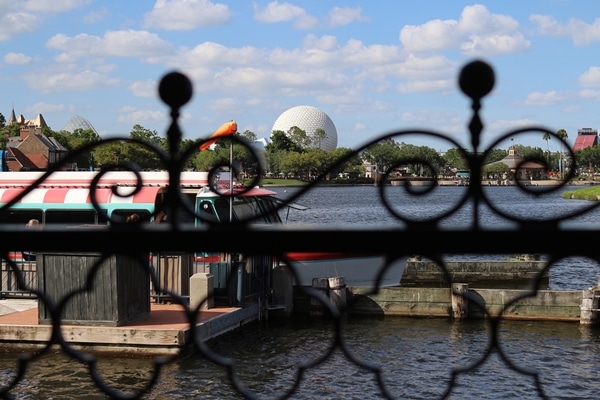 view of Spaceship Earth at Epcot through a metal fence