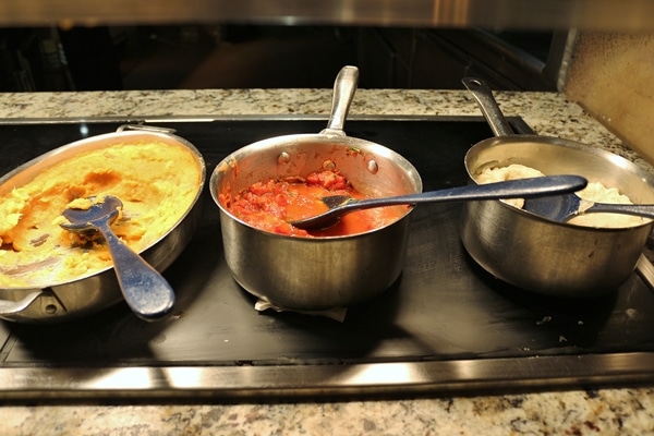 several pots of food on a buffet line