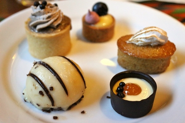 a plate of bite-sized desserts