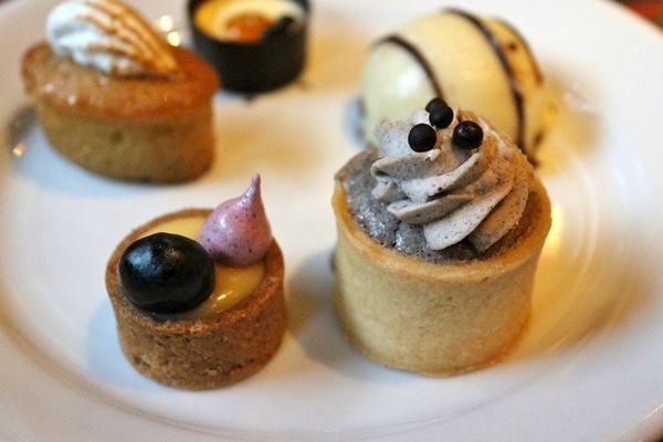 A close up bite-sized desserts on a plate