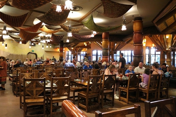 many tables and chairs in a restaurant dining room