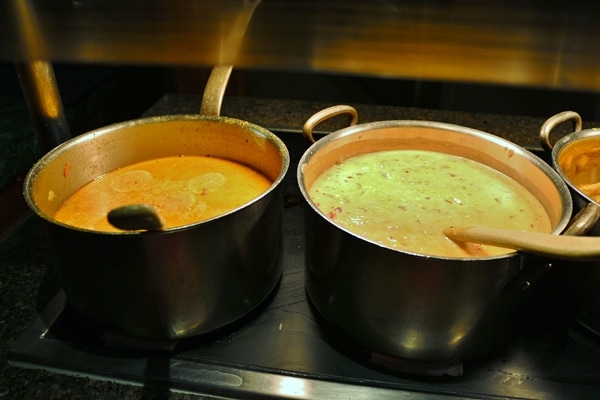 2 pots of soup on a buffet