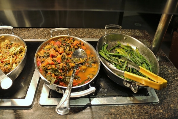 pans of vegetables on a buffet line