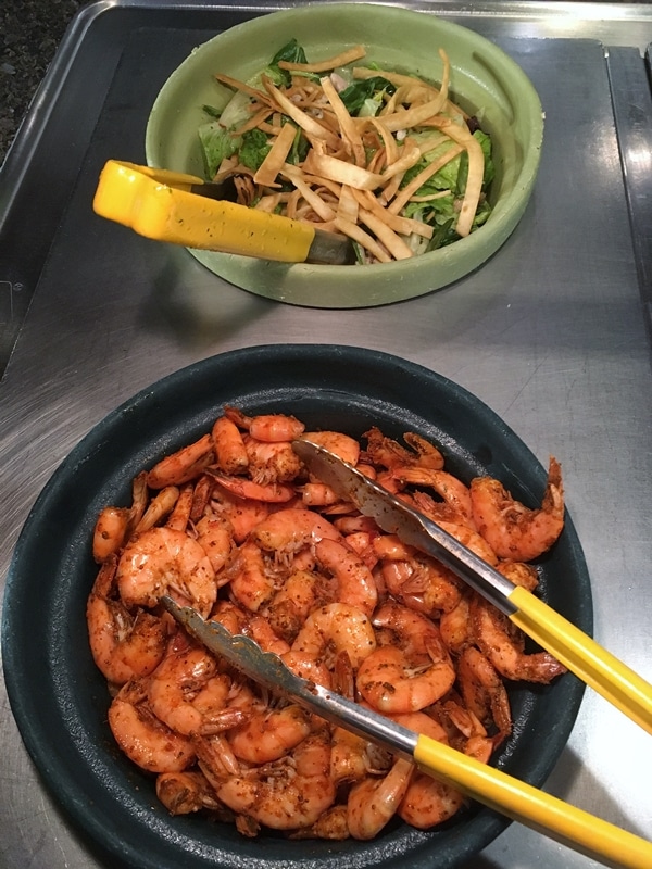 shrimp and salad in a buffet