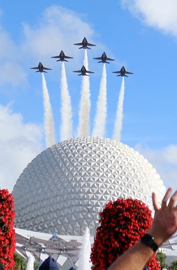 the Blue Angels airplanes flying over Spaceship Earth in Epcot