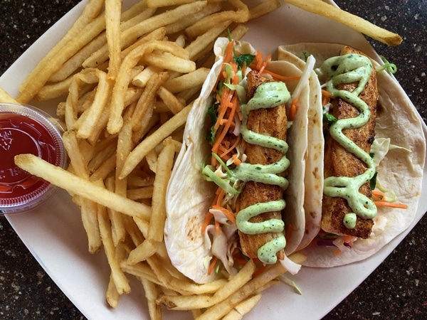 fish tacos and fries on a square plate