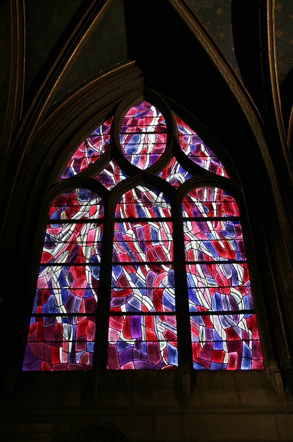 brightly colored stained glass windows in a church