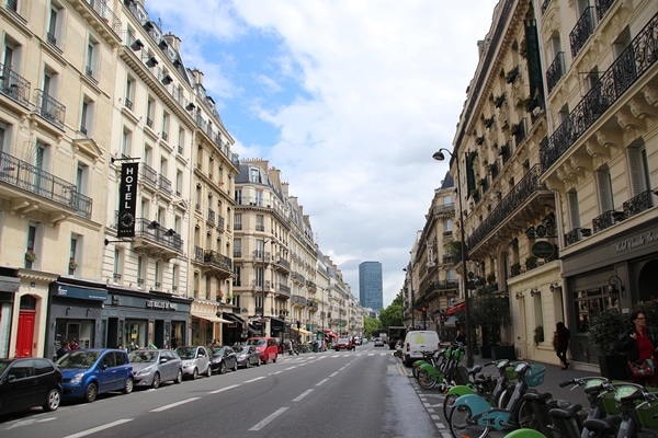 a Parisian street lined with cars