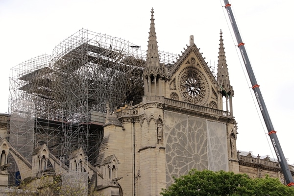 a closeup of Notre Dame Cathedral with a burnt roof