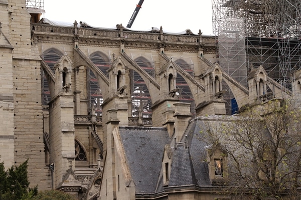 a closeup of Notre Dame Cathedral missing its roof