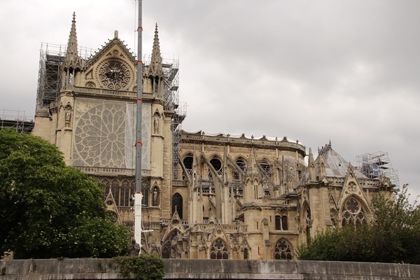 a wide view of Notre Dame Cathedral missing its roof