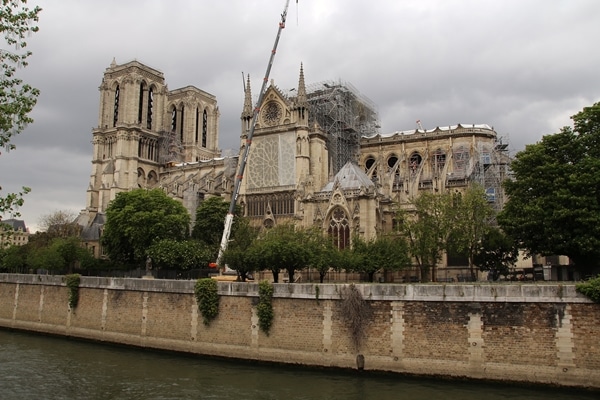 side view of Notre Dame Cathedral from across the river