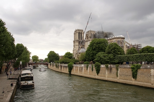 view of Notre Dame Cathedral from a nearby bridge