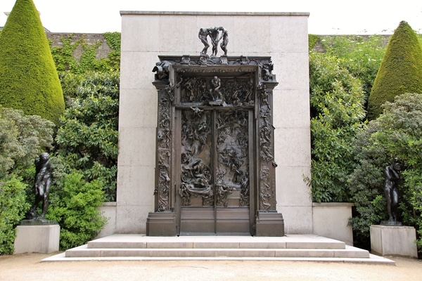 Rodin\'s famous Gates of Hell sculpture in a garden