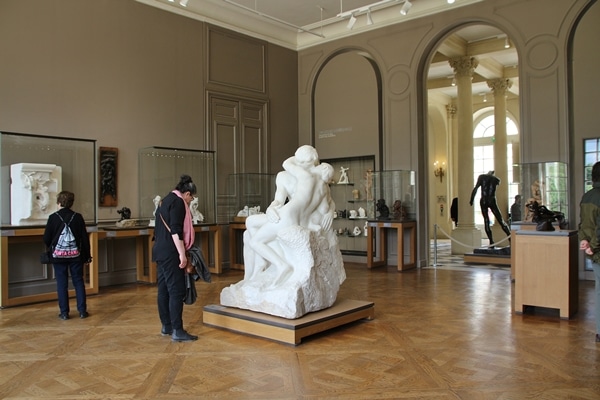 a room full of sculptures in a museum