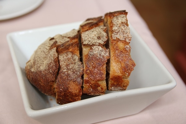 sliced crusty bread on a white plate