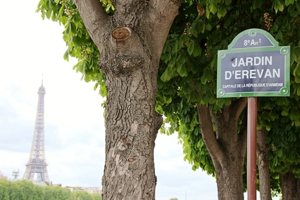 A sign on the side of a tree